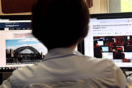 A person browses through media websites on a computer on May 30, 2013.