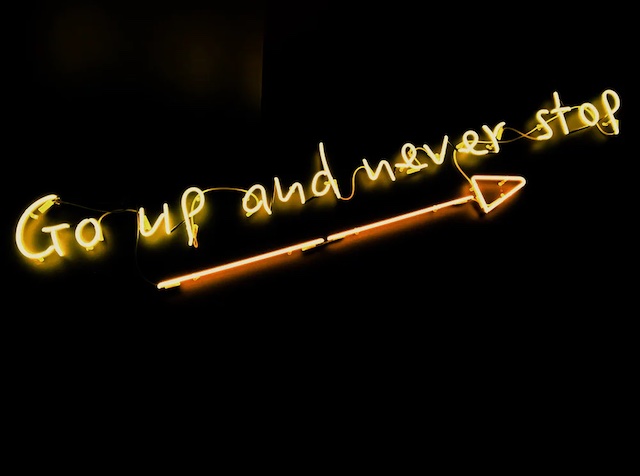 photo of a sign that says up and up and never stop